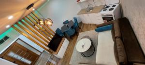 an overhead view of a living room with a couch and a television at Apartman 3M Lux in Vrnjačka Banja +31 photos
