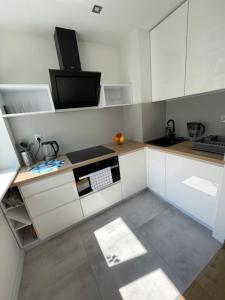 Kuchyňa alebo kuchynka v ubytovaní Chill Apartament Gdynia