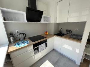 Kuchyňa alebo kuchynka v ubytovaní Chill Apartament Gdynia