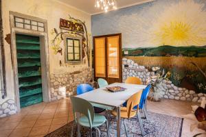 a dining room with a table and chairs at B&B La Serra in San Miniato