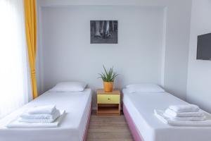 מיטה או מיטות בחדר ב-Olya Boutique Hotel