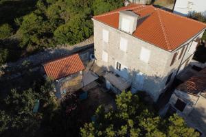 an overhead view of a building with a red roof at Stonehouse on peaceful Island of Unije in Unije