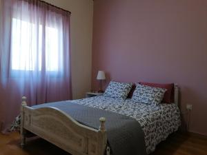 Кровать или кровати в номере House de Fountas