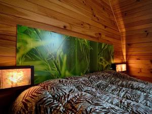 Llit o llits en una habitació de Maison de vacances La Valessoune