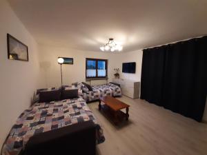 A bed or beds in a room at La Maison de Joanna 2