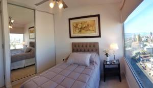 Postel nebo postele na pokoji v ubytování Departamento súper céntrico con vista al río Paraná + 35 fotografií