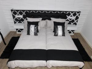 Cama o camas de una habitación en HOTEL TERRA GALEGA MEIGA