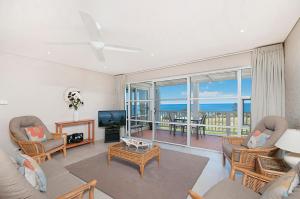 a living room with a view of the ocean at Quarterdeck 20 in Lennox Head