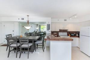a kitchen and dining room with a table and chairs at Entire condo at Aventura in Aventura