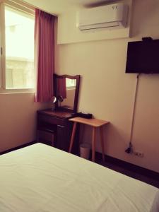 Tempat tidur dalam kamar di 星海芝家民宿Samuel's Home