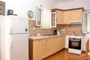Kuchyň nebo kuchyňský kout v ubytování Holiday Apartments Tonia - Pelekas Beach