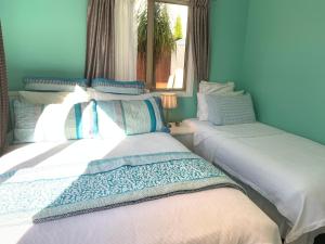 Ένα ή περισσότερα κρεβάτια σε δωμάτιο στο Amazing Seaview House