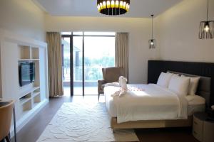 Voodi või voodid majutusasutuse Udman Hotel Greater Noida toas
