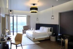 Voodi või voodid majutusasutuse Udman Hotel Greater Noida toas