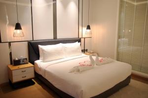 Voodi või voodid majutusasutuse Udman Hotel Greater Noida toas
