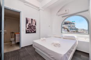 Ένα ή περισσότερα κρεβάτια σε δωμάτιο στο Katris Apartments