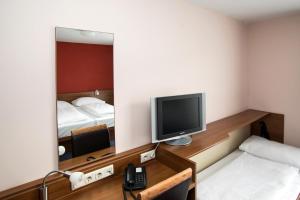 TV a/nebo společenská místnost v ubytování Club Hotel am Kreischberg