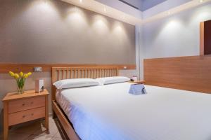 Postel nebo postele na pokoji v ubytování Hotel Palace