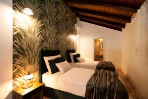 a bedroom with a bed and a wall mural at Luxury Villa Nature with heated private pool, sauna & fire pit, a short walk to the beach in Milna