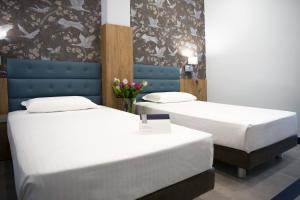 Postel nebo postele na pokoji v ubytování Hotel Palace + 37 fotografií