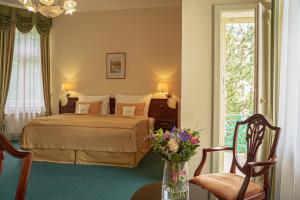Posteľ alebo postele v izbe v ubytovaní Hotel Mignon