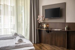 Televízia a/alebo spoločenská miestnosť v ubytovaní Spa Residence Carbona Hévíz - Relax, Sissi Apartmanok