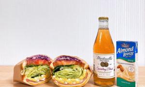 a bottle of beer and two sandwiches and a soda at 1962 Business Hotel Chuncheon Branch in Chuncheon