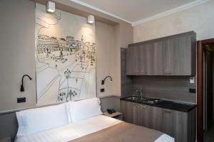 Postel nebo postele na pokoji v ubytování Hotel Plaza