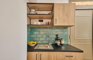 a kitchen with a sink and a counter top at City Experience Apartments A in Heraklio Town