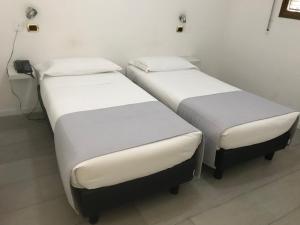 Posteľ alebo postele v izbe v ubytovaní Hp Fly Hotel Bologna