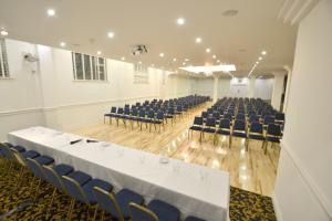 a large room with a table and chairs in it at Bay View Hotel in Killybegs