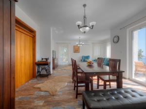 a dining room with a table and chairs at Villa Tranquila in Budva