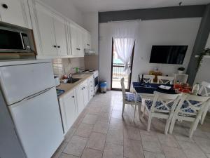 Kuchyňa alebo kuchynka v ubytovaní Lucas Lux Flogita apartment