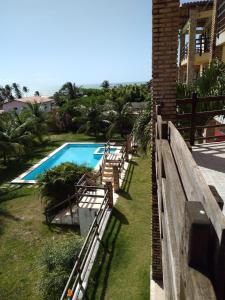 a view of a swimming pool from a building at Zago Apartamento Temporada Vista Mar in Aquiraz