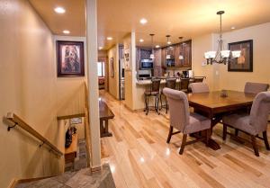 a dining room and kitchen with a table and chairs at Beaver Creek West 14 in Avon