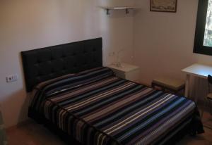 Holiday villa in Platja de Pals tesisinde bir odada yatak veya yataklar