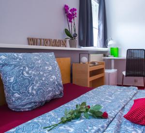 Postel nebo postele na pokoji v ubytování Hotel Garni am Eckernweg