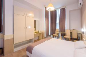Postel nebo postele na pokoji v ubytování Hotel MB