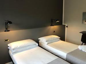 Posteľ alebo postele v izbe v ubytovaní Hp Fly Hotel Bologna