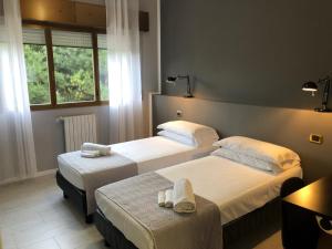 Posteľ alebo postele v izbe v ubytovaní Hp Fly Hotel Bologna