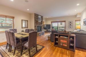 a living room with a table and a couch at Elkhorn Townhome 1939 in Ouray