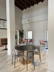 a dining room with a table and chairs at Hacienda Soto-Hego Haizea in Chiclana de la Frontera +16 photos