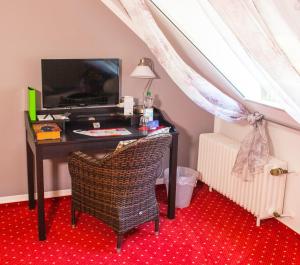 TV a/nebo společenská místnost v ubytování Hotel Garni am Eckernweg