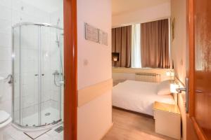 Postel nebo postele na pokoji v ubytování Hotel MB