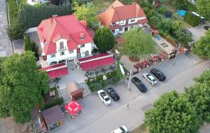 an overhead view of a house with cars parked on the street at Székely Kúria in Miskolctapolca