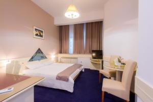 Postel nebo postele na pokoji v ubytování Hotel MB