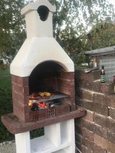 a brick oven with food inside of it at Homerhof - Hofmann Johann junior in Rottau