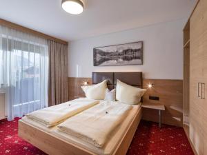 Posteľ alebo postele v izbe v ubytovaní Landhaus Alpina