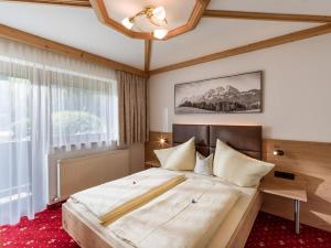 Posteľ alebo postele v izbe v ubytovaní Landhaus Alpina