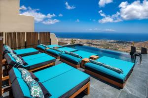 a villa with a view of the ocean at Skyfall Suites - Adults Only in Pyrgos